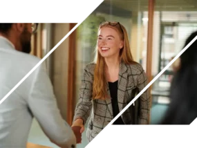 A redhead woman shaking a hiring manager's hand after applying at ICCU.