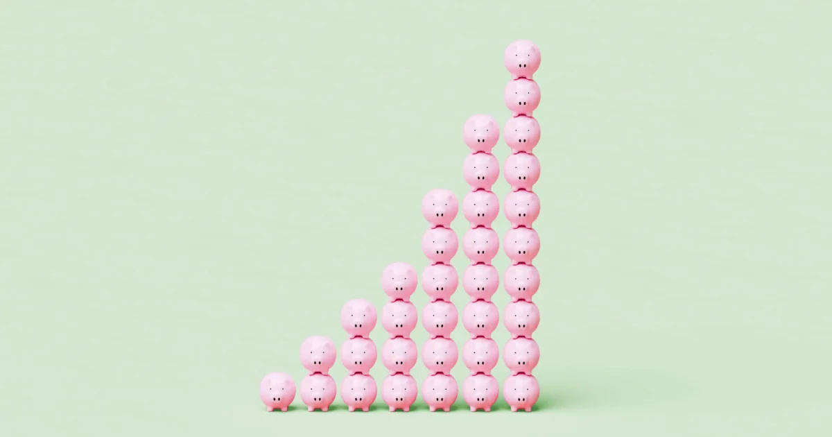 Stacks of piggy banks growing over time.