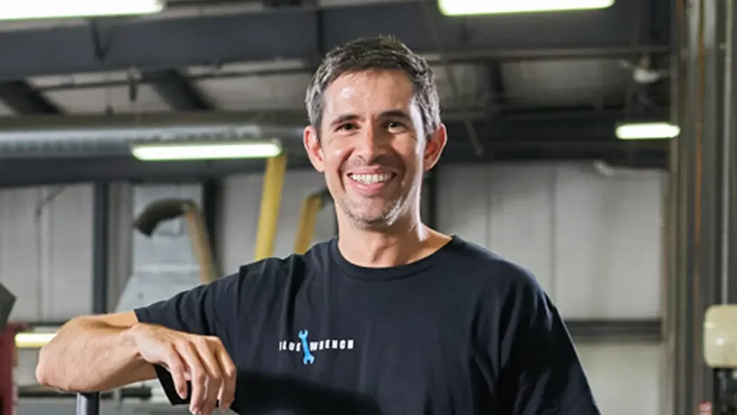Blue Wrench co-owner smiling.