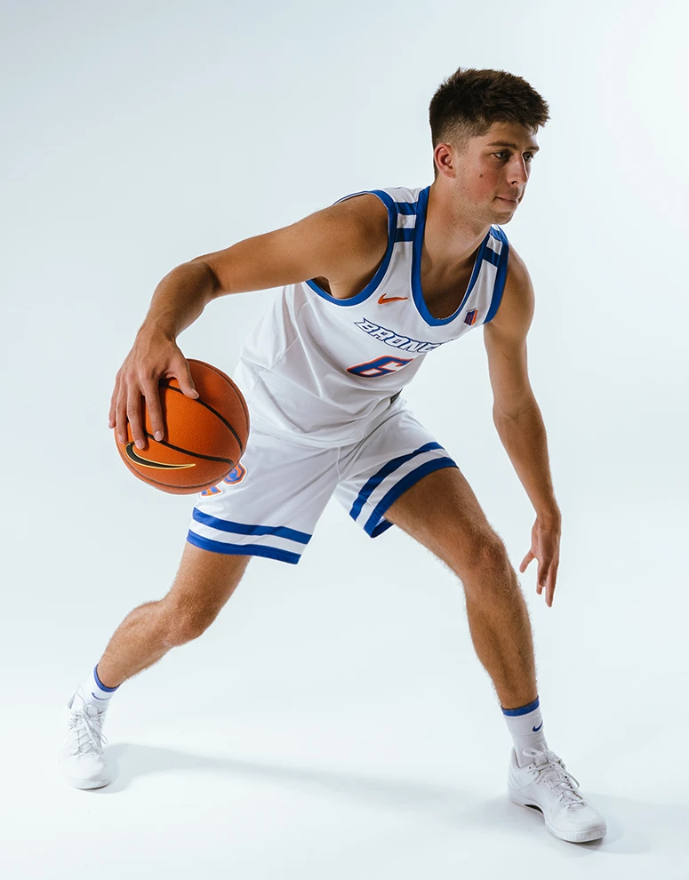 Pearson Carmichael dribbles the ball, demonstrating control and agility during a photoshoot.