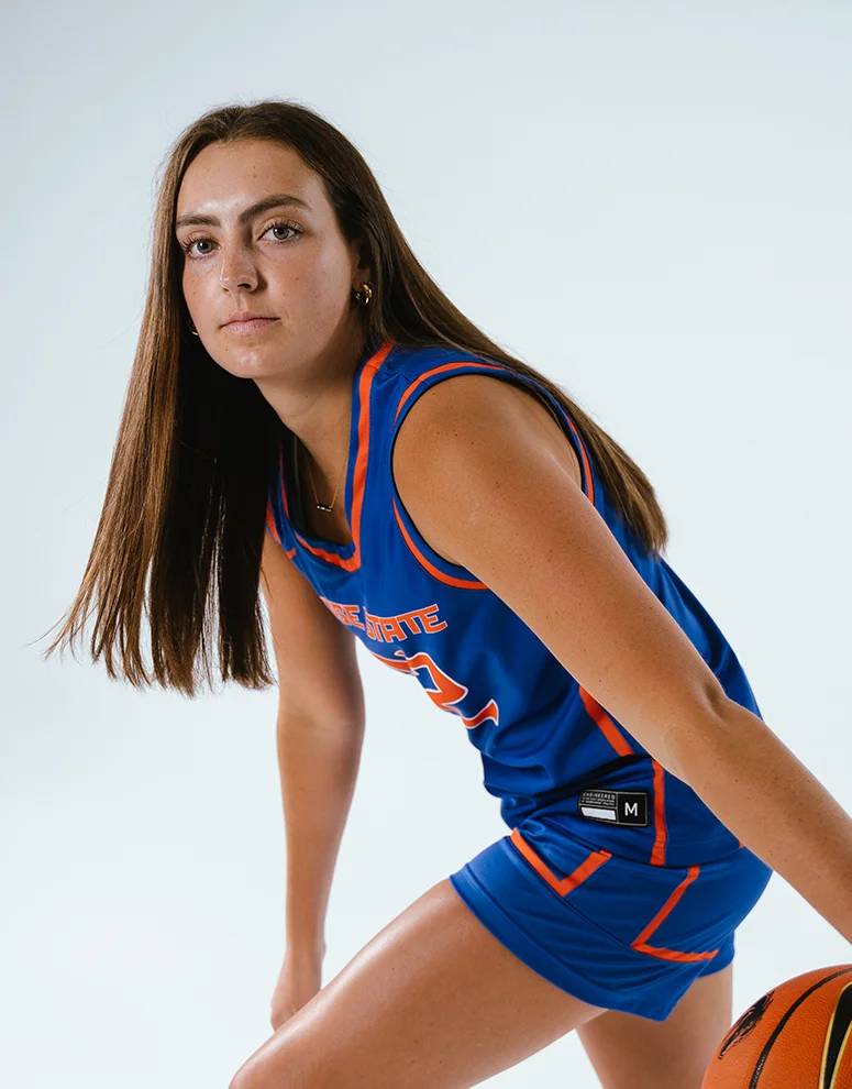 Natalie Pasco dribbles a basketball with focus and intensity during a photoshoot for ICCU and Boise State.