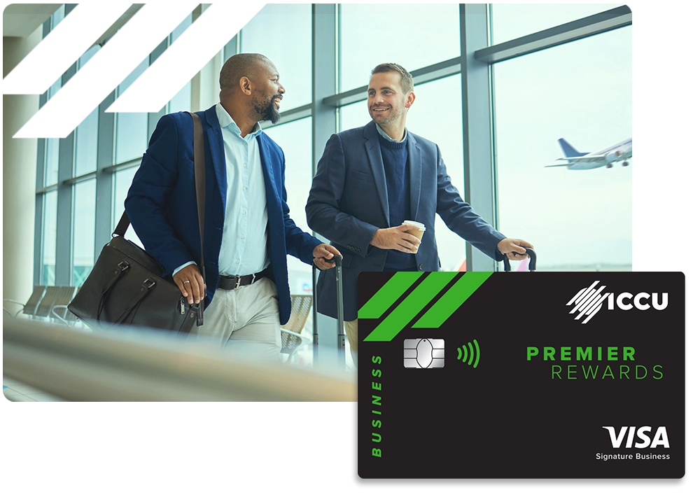 Two men in suits at the airport with a graphic of the ICCU Business Premiere Rewards Credit Card